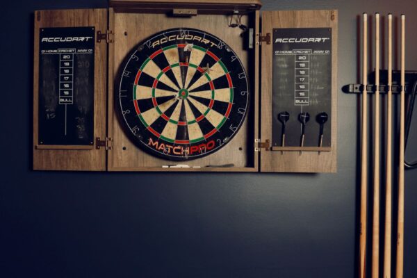 dart board w pool cues tall